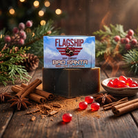 Bad Santa Red Hot Cinnamon soap with cinnamon sticks, star anise and red candies on wood