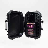 Bravo Zulu BELLE Extrait de Parfum by Flagship Soap Company shown docked inside its open black rugged tactical case, the matte black glass bottle secured in the honeycomb interior insert opposite the white foam-lined lid, on a seamless white studio background.