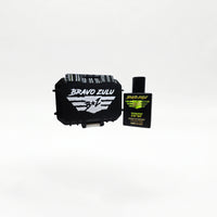 Closed black rugged tactical travel case for Bravo Zulu TIPSY Extrait de Parfum by Flagship Soap Company, front view showing the white BRAVO ZULU B★Z winged logo on the case exterior, on a seamless white studio background.