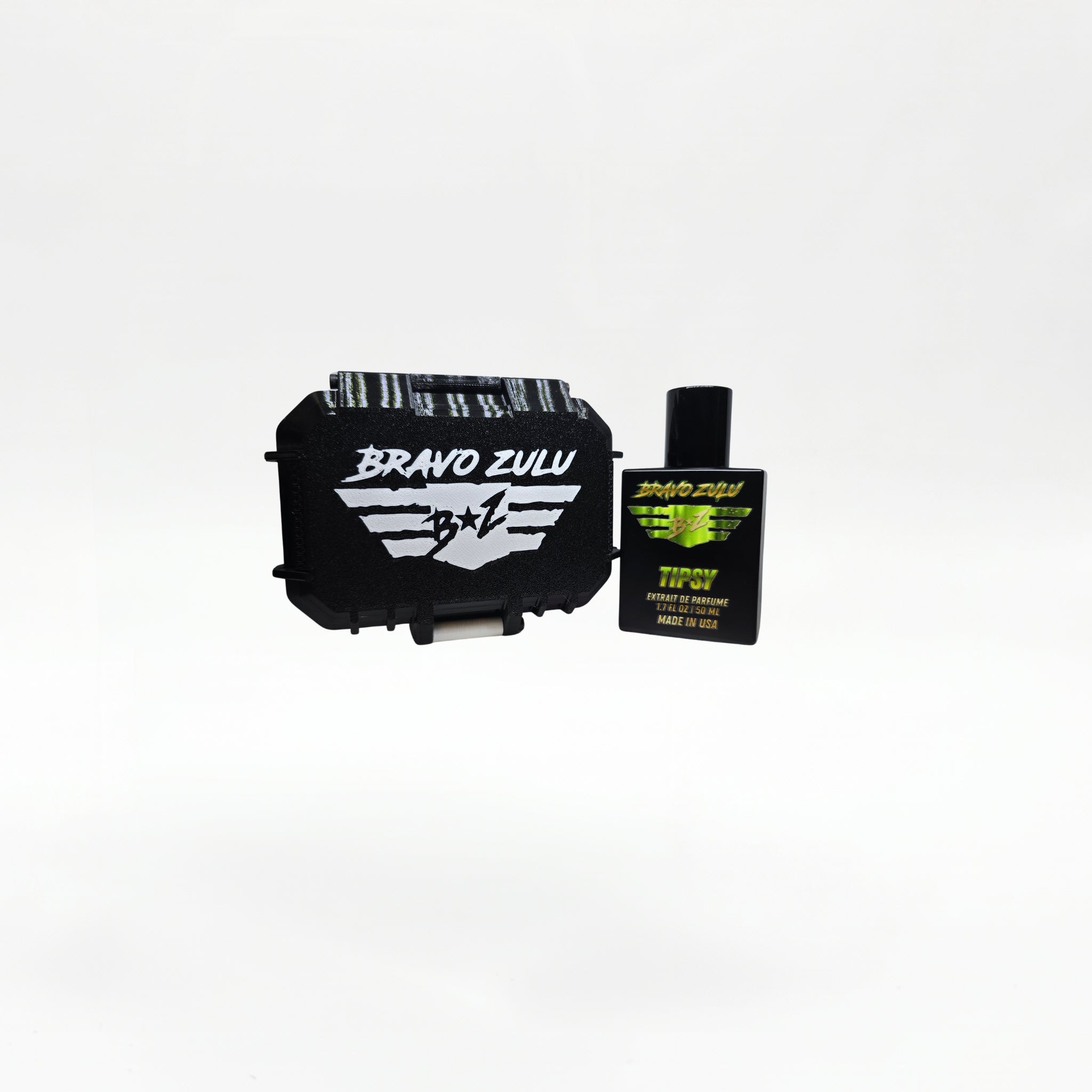 Closed black rugged tactical travel case for Bravo Zulu TIPSY Extrait de Parfum by Flagship Soap Company, front view showing the white BRAVO ZULU B★Z winged logo on the case exterior, on a seamless white studio background.