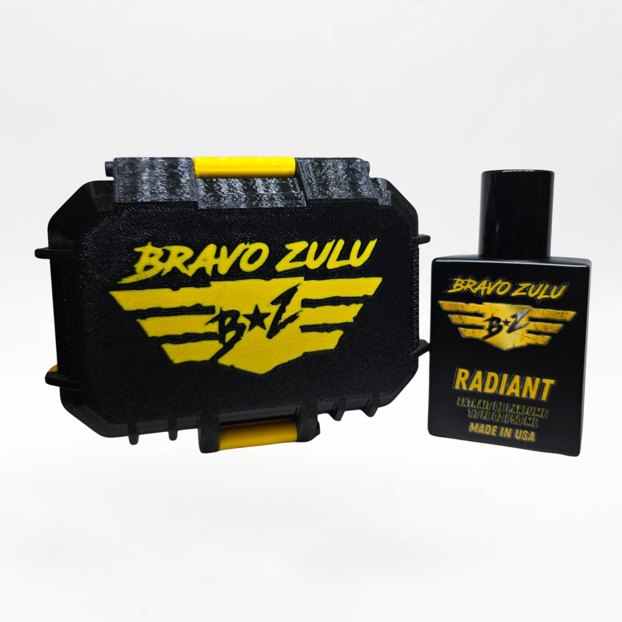 Alternate three-quarter angled studio shot of the Bravo Zulu RADIANT Extrait de Parfum bottle by Flagship Soap Company, rotated to show the gold-and-black BRAVO ZULU B★Z winged logo and RADIANT name from a different perspective, on a seamless white studio background.