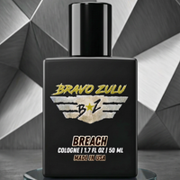 Black cologne bottle with 'Bravo Zulu' branding on a geometric background
