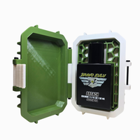 Green and white container with a blackBravo Zulu product inside on a white background