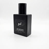 A product shot of a 40ml compact footprint bottle of BLACKOUT Extrait de Parfum from Flagship Soap Company, an aggressive, tactical masterpiece engineered for the men who run toward the chaos. The matte black glass bottle is heavy and tactical, designed to block UV light. The hardware includes a monochromatic Stealth Black cap and an Ultra-Fine Professional-Grade Atomizer that delivers a pressurized, micro-fine mist. On the front, minimalist white text reads 'BRAVO ZULU' above 'BLACKOUT', with smaller text 