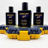 A three-bottle collection image of F.A.F.O. Extrait de Parfum by Flagship Soap Company. Three tactical matte black glass cologne bottles are arranged in a pyramid formation, each sitting on top of its own custom-engineered rugged protective case. The cases showcase a textured Tactical Blue finish with high-visibility Strike Yellow contrast accents and latches. Each bottle prominently displays the purple and yellow Bravo Zulu BZ logo, representing an elite 30% concentration fragrance built for uncompromising