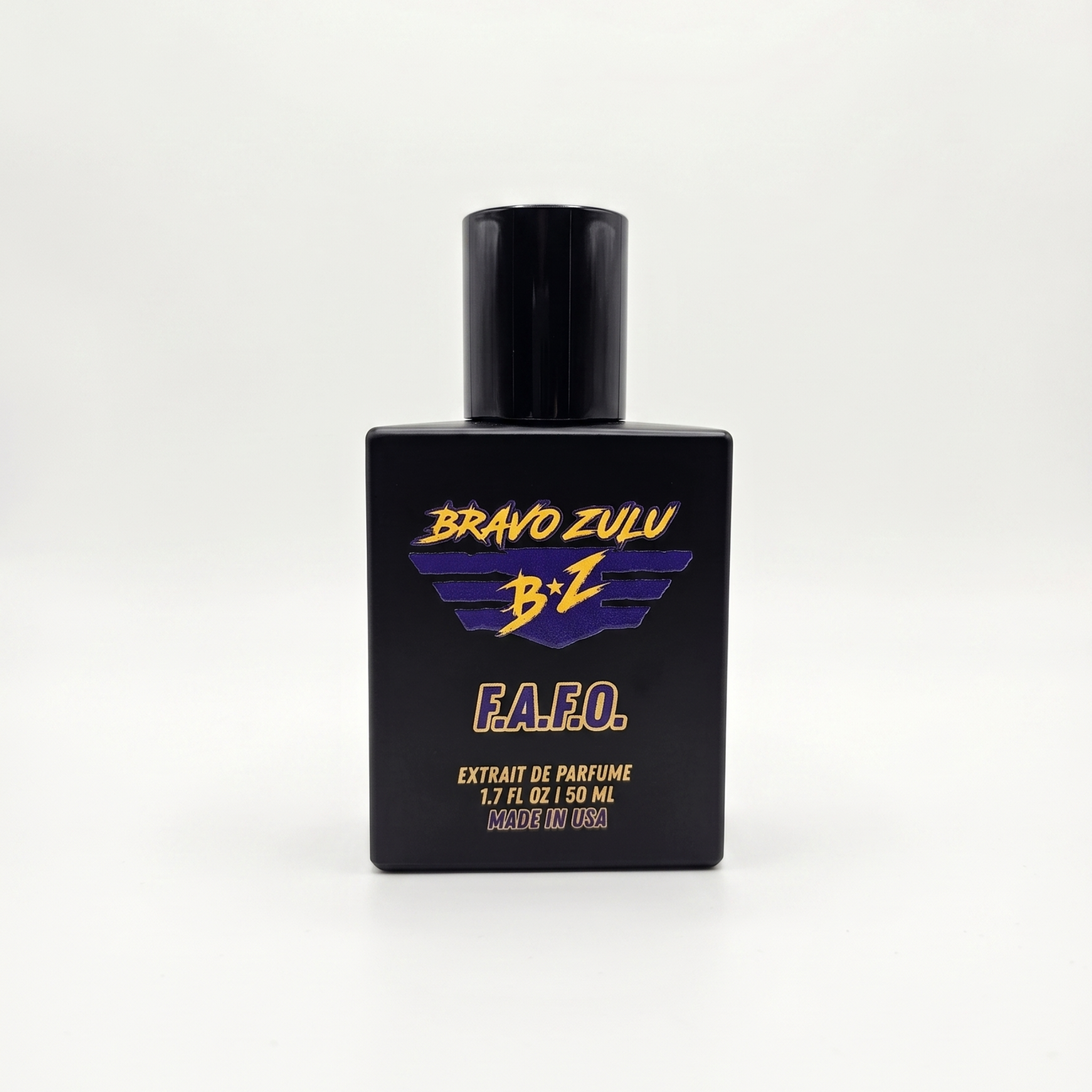 Centered studio product shot of F.A.F.O. Extrait de Parfum cologne by Flagship Soap Company. The heavy, tactical matte black glass bottle is shown from a straight-on perspective, highlighting the high-contrast purple and yellow Bravo Zulu BZ logo, gold F.A.F.O. branding, and product specifications for the true 30% concentration fragrance oils. The bottle stands alone, isolated on a seamless, clean white background to deliver an elite e-commerce presentation.