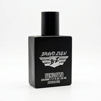 A professional product photograph taken at an angle, showcasing the heavy, tactical matte black glass bottle of Bravo Zulu Vendetta fragrance against a clean white background. The bottle, featuring the distinctive silver winged B+Z logo, stands centered. The label text "BRAVO ZULU" is prominent above the emblem, with "VENDETTA" below it in bold, commanding letters. Smaller white text reads "COLOGNE | 1.7 FL. OZ | 50 ML" and "MADE IN USA". The description identifies this as a massive, true 30% oil concentrat