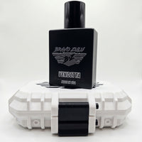 A tactical product display featuring the matte black glass bottle of Bravo Zulu VENDETTA Extrait de Parfum standing centered on top of its rugged, custom-engineered tactical case. The black bottle features a silver-embossed B★Z winged shield crest and the text "VENDETTA | COLOGNE | 1.7 FL OZ / 50 ML | MADE IN USA." The tactical fusion inside, a high-yield formula engineered for American grit and calculated precision, creates a wood-and-spice smoke screen locking onto the skin with 30% oil concentration. It 