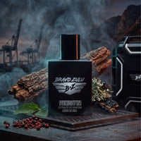 Alt Text: A dramatic product photograph visualizing the scent architecture of the Bravo Zulu VENDETTA fragrance, with the heavy, tactical matte black glass bottle positioned front and center on a rugged metal industrial grate.

Atmospheric smoke swirls around the bottle, highlighting a deep, dangerous wood-and-spice smoke screen. In the foreground, the fragrance's core ingredients are exposed, showing a wave of crushed peppercorns, a fresh green leaf representing wild patchouli, and chunks of raw, smoky ced