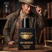 Matte black tactical glass bottle of Bravo Zulu BAD DECISIONS Extrait de Parfum by Flagship Soap Company, displayed on a rustic wood tray. The 30% concentration premium whiskey-themed cologne features gold texturing. In the atmospheric, moody background, a rugged man resembling John Wayne tips his cowboy hat in a dimly lit study with a glass decanter and books.