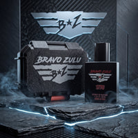 ravo Zulu's 1776 Extrait de Parfum matte black cologne bottle and its rugged, textured tactical protective case resting on dark slate rock slabs with neon-blue edge lighting and drifting smoke. The background features a tactical, brushed metallic and carbon-fiber paneling design with a large, glowing metallic wings logo. The bottle label clearly showcases the silver wings emblem and bold red 1776 text, highlighting this high-performance, 30% oil concentration American-made Bay Rum fragrance.