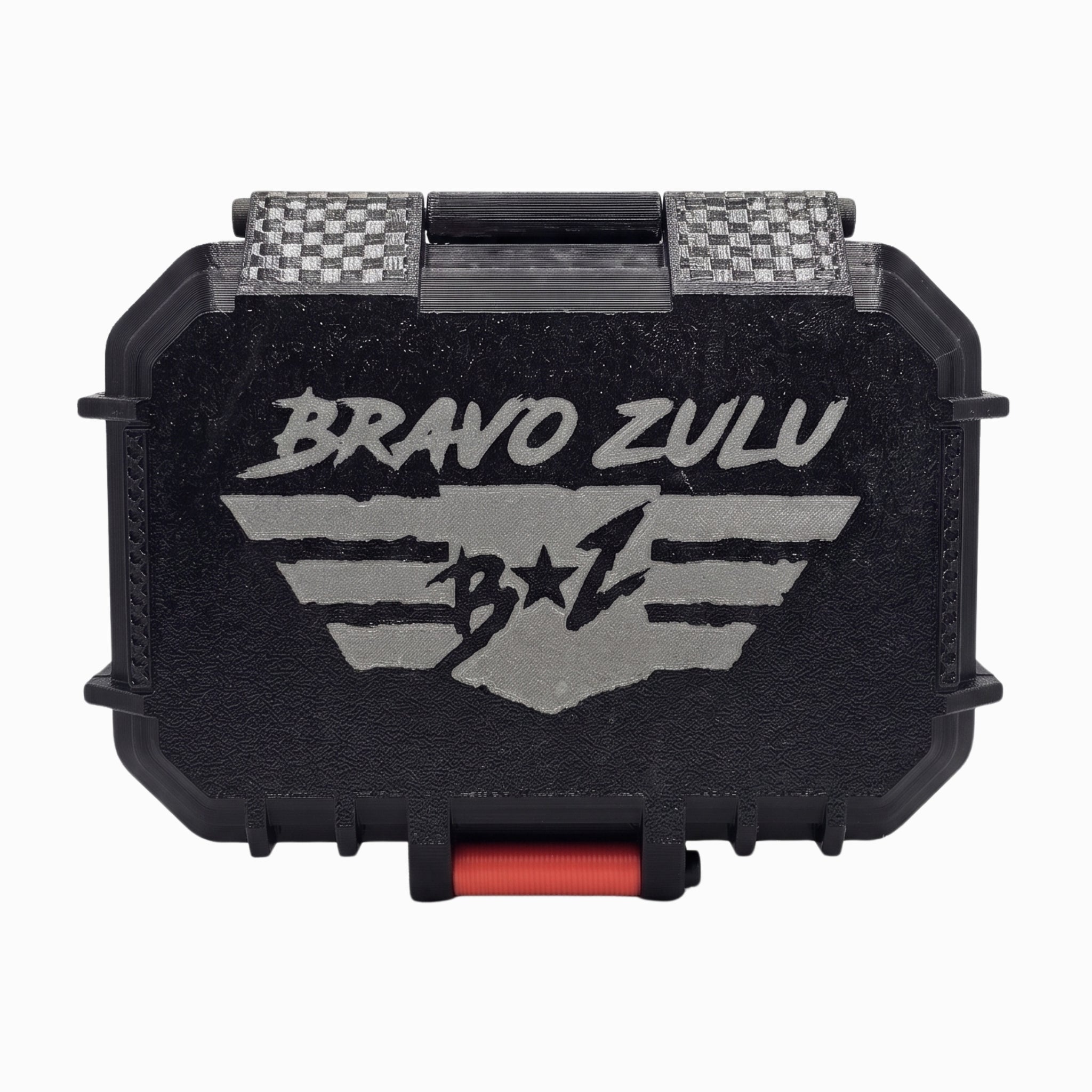 A closed Bravo Zulu tactical protective case for 1776 Extrait de Parfum, centered on a white background. The heavy-duty black case features a rugged texture, a prominent silver-gray debossed tactical wings logo, a carbon-fiber textured hinge, and a crimson red front closure latch. The premium hardware is designed to securely house and protect the 30% oil concentration, American-made masculine cologne.