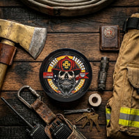 Flagship Soap Company Hose Dragger beard butter centered on a charred wood table, surrounded by firefighter gear including a brass axe, leather radio holster, turnout jacket, and a Halligan tool.