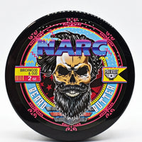 High-resolution product shot of the NARC Birchwood and Oud beard butter lid, featuring a vibrant 80s-inspired bearded skull graphic and Flagship Soap Company’s Patriot branding.