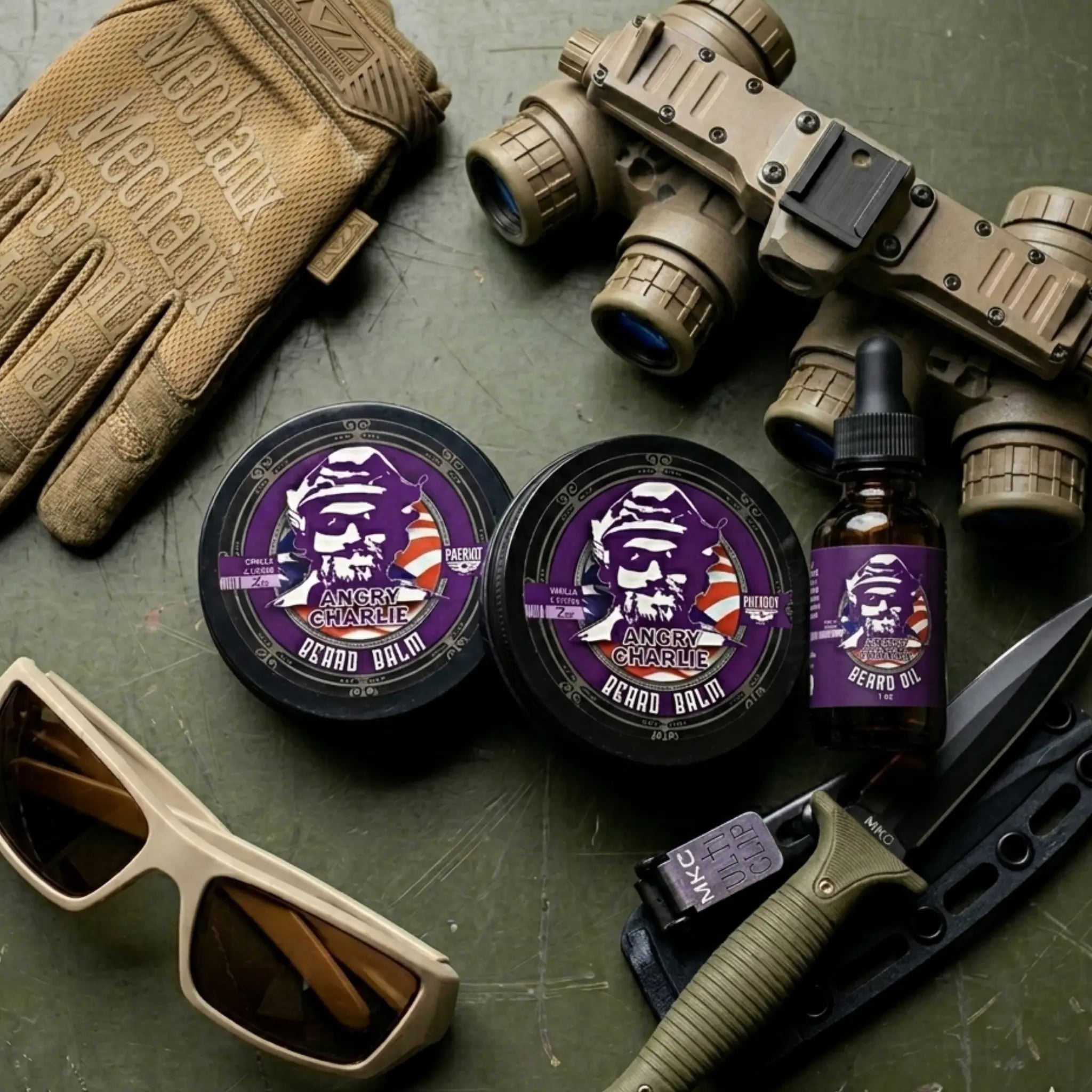 A bundle of Angry Charlie beard balm and oil in a masculine vanilla cedarwood scent, styled with night vision gear, combat gloves, and tactical accessories.