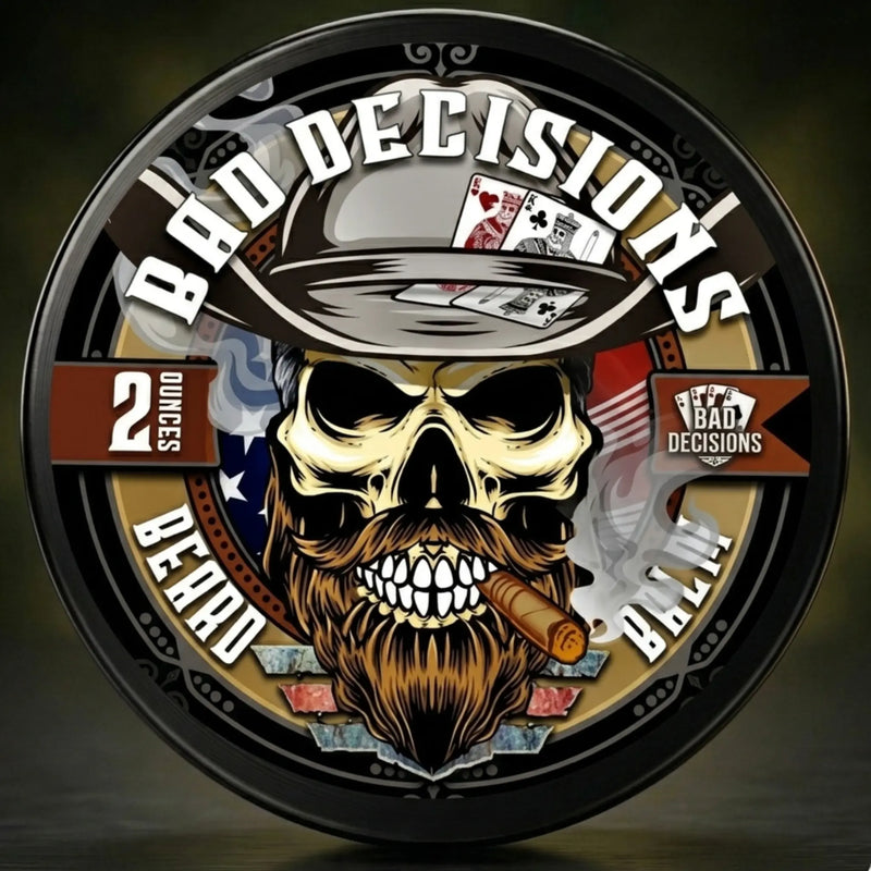 Bad Decisions Beard Balm by Flagship Soap Co. featuring a skull wearing a fedora with playing cards and smoking a cigar. This patriotic, 2oz tin is a great grooming gift for men who enjoy a rugged, outlaw-inspired lifestyle.