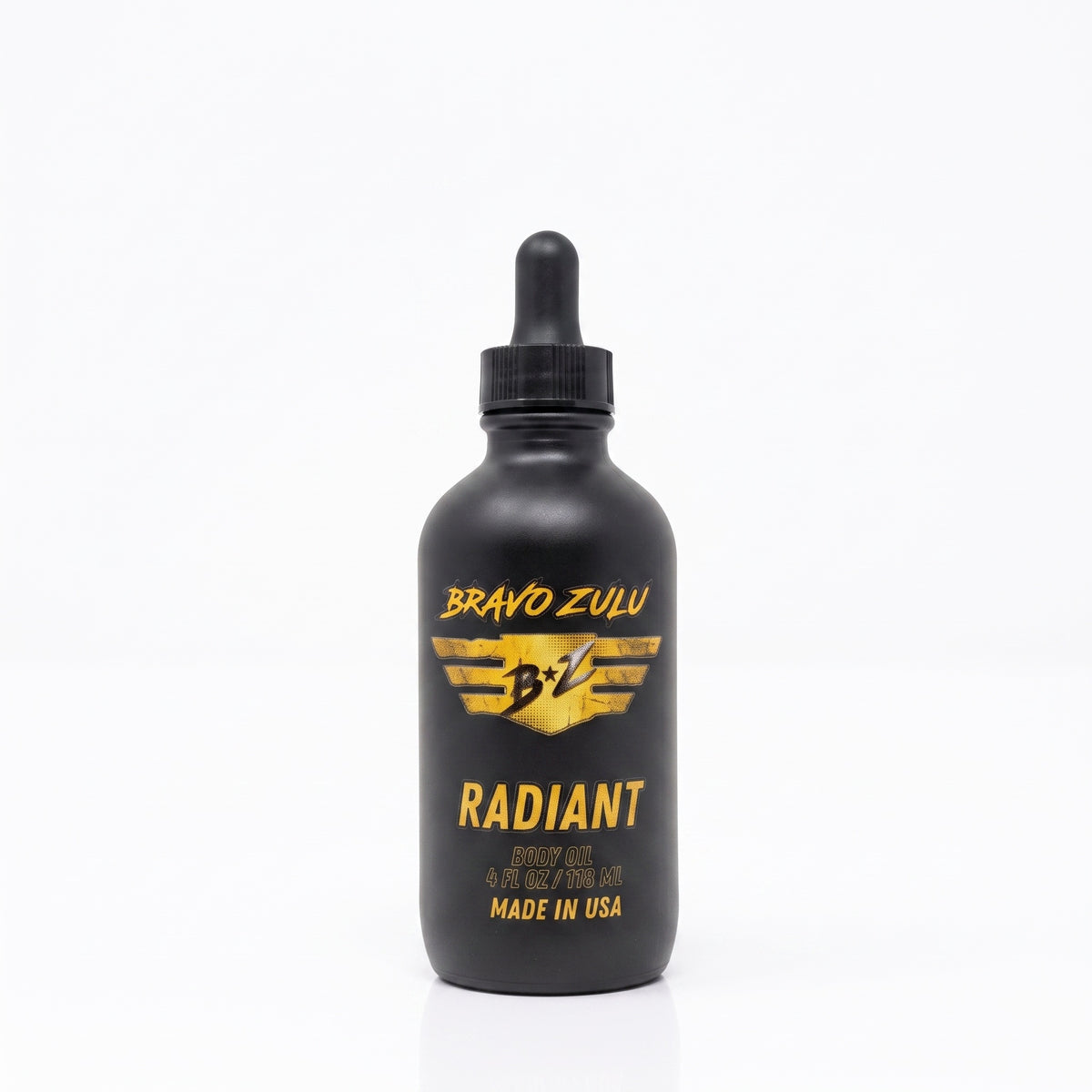 Bravo Zulu Radiant Body Oil dropper bottle studio product shot on white background, matte black glass with gold Bravo Zulu B★Z logo, 4 fl oz / 120 mL