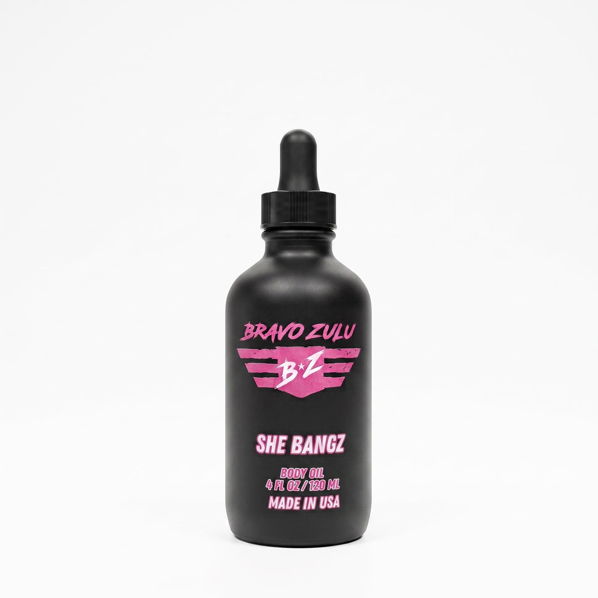 Bravo Zulu She Bangz Body Oil dropper bottle studio product shot on white background, matte black glass with pink Bravo Zulu B★Z logo, 4 fl oz / 120 mL