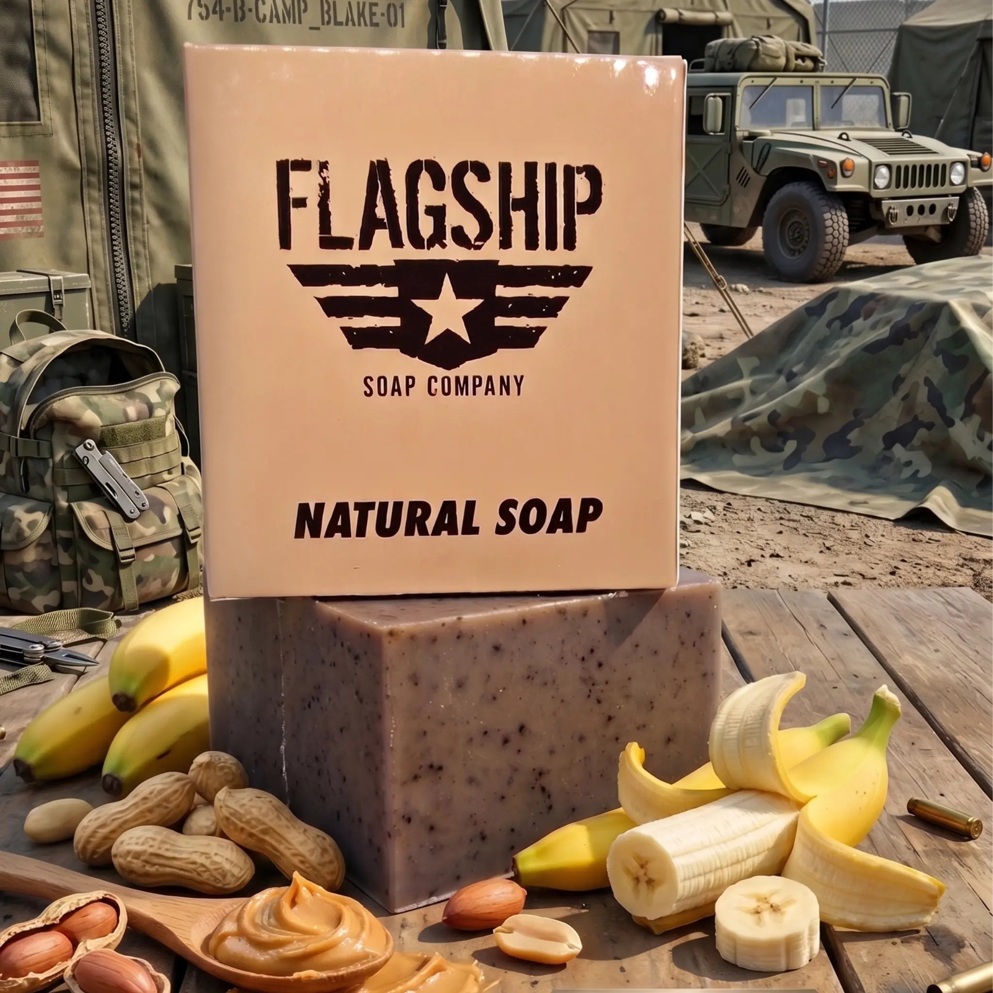 A tactical product presentation of the "Brick Maker" soap on a rough wooden military mess table. The full-package box (angled front view, showing the "SSL" acronym and crest) and the bar (back version, showing full logo and "NATURAL SOAP") are shown, surrounded by their core MRE flavor profile: a bundle of whole bananas, peanuts in the shell, a wooden spoon of peanut butter, and scattered peanuts. The background features a detailed military camp with olive-drab canvas tents 