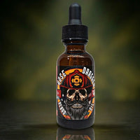 Hose Dragger Beard Oil in a classic Musk scent. The label honors firefighters with a bearded skull wearing a red fire helmet. A specialized, patriotic oil for first responders and heroes.