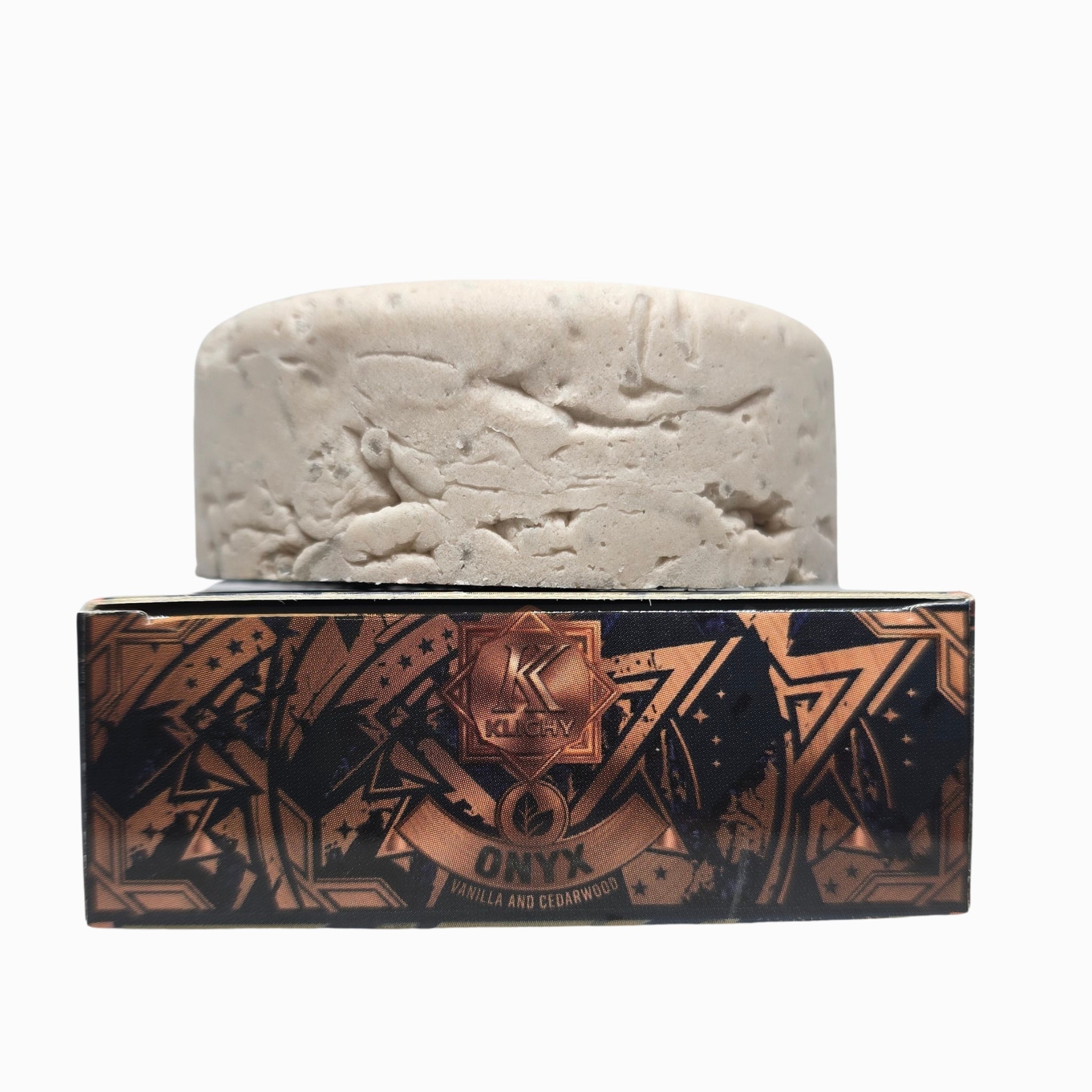 Onyx natural shampoo bar puck stacked on Klichy Vanilla and Cedarwood box