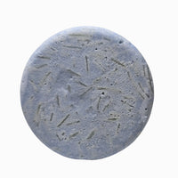 Close-up of Tingle Balls peppermint and vanilla natural beard wash puck texture