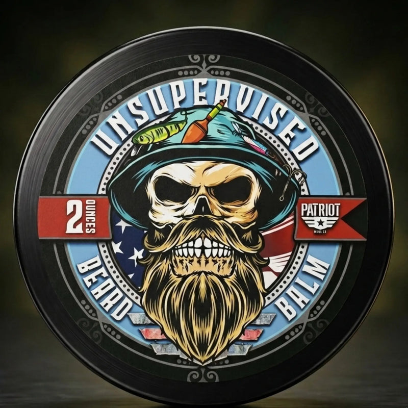 Close-up of the 2-ounce Unsupervised Beard Balm tin featuring the top-selling Patriot label and bold masculine cologne fragrance profile.