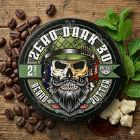 Zero Dark 30 beard butter tin by Flagship Soap Co. displayed with fresh mint leaves, roasted coffee beans, and raw shea butter to highlight the spearmint and coffee scent.